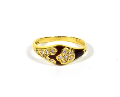 An 18 carat gold diamond and red enamel ring, finger size L.  Gross weight - 3.27 grams. 