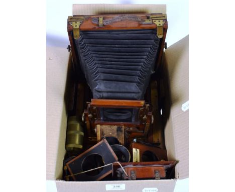 A wooden plate camera, circa 1900, with lens, plates etc 