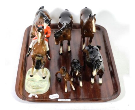 A Beswick pottery model of a rearing huntsman number 868 (a.f.) together with six other Beswick pottery brown horses and foal