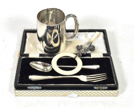 A novelty silver owl child's rattle, Crisford &amp; Norris, Birmingham 1949; a Christening mug, Sheffield 1907; and a cased s