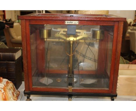 A cased set of scientific scales by Oertling Ltd London.Height 42cm,width 44cm,depth 27cm collection only 