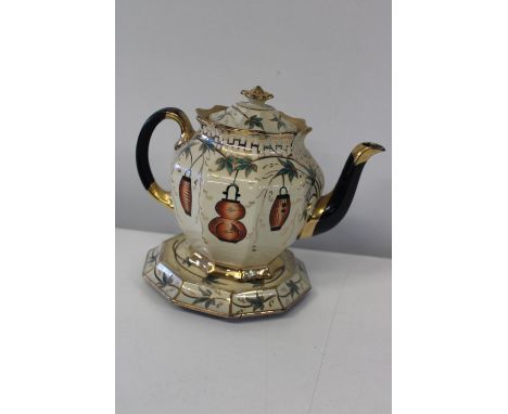 A vintage teapot on stand 