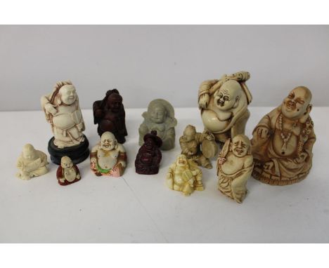 A shelf full of assorted Buddhas 