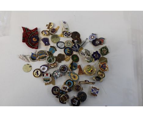 A job lot of assorted enamel badges etc 