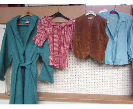 Four items of ladies clothing including a French part wool blue dressing gown a 1950's Harrods red and white candy stripe blo