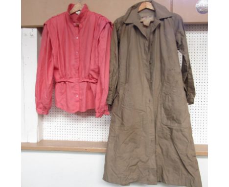 A Saint Laurent, rive gauche buff coloured lady's rain-mac with belt, heavily stained and a Giorgio Armani early 80's peach c