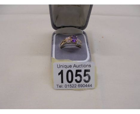 An amethyst/diamond set ring in 9ct gold , size N, 2.9 grams. 