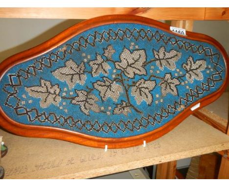 A late Victorian beaded tray in mahogany surround. 