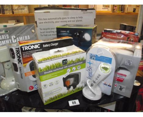 A misc lot of new items including ear and forehead thermometer, alarm system, solar lights etc 