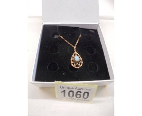 A 9ct gold opal set pendant in an openwork mount. Weight 2.7g