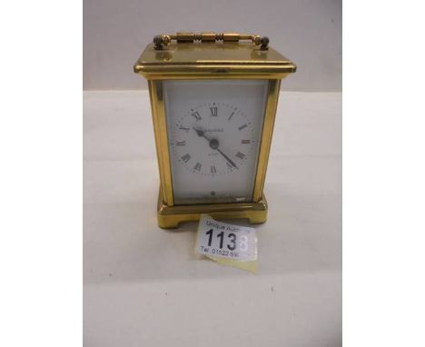 A brass carriage clock. 