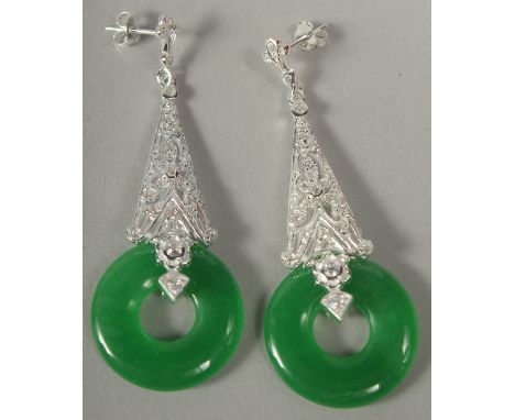 A pair of silver long drop Deco style jade earrings in a box.