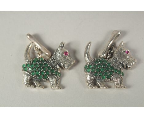 A pair of silver Scotty dog cufflinks in a box.