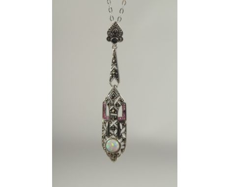 A silver marcasite ruby and opal pendant and chain in a box.