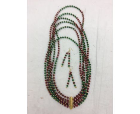 A ruby and emerald necklace and earrings