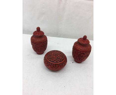 A pair of Chinese cinnabar and enamel vases; together with a bowl