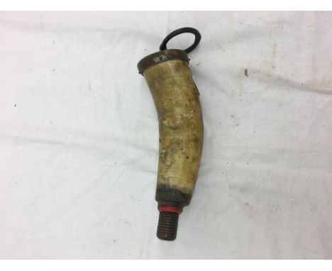 A 19th century cow horn shot flask