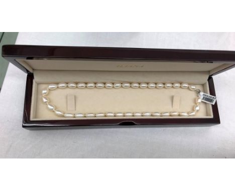 An 18ct gold clasped baroque pearl necklace