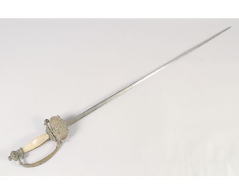 A FRENCH COURT SWORD SECOND EMPIRE, circa 1810, slender etched blade of hollow triangular section, shell guard with Imperial 