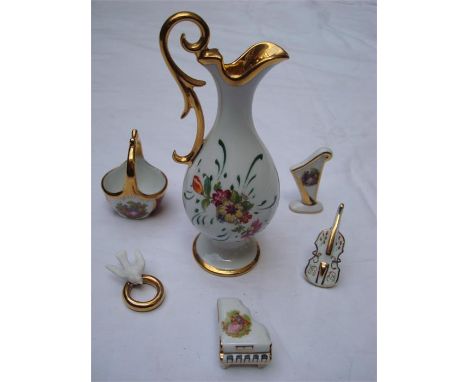 Six Limoges miniatures to include a piano, a harp, a violin, a basket, a pitcher and a dove with ring (6). 