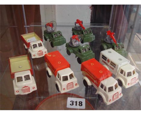 Wells Brimtoy tinplate and plastic friction drive vehicles to include: Speedy Transport Co, Ambulance, Army rocket launcher a
