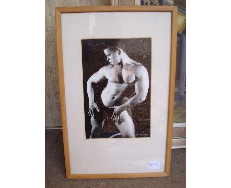 A framed David Burgess photographic print of a muscular nude male. 
