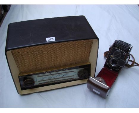 An Ekco VHF/AM radio, model U.319A together with a vintage Yashica-Mat camera (in case). 