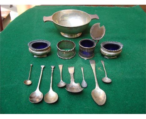 A collection of silver to include a pairof salts with blue glass liners, Birmingham, 1913 by E S Barnsley & Co Ltd; a blue gl