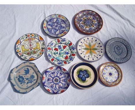 Decorative plates, one with blues, greens, oranges and reds (Pintado a Mano), another with fish decoration, one in blues, gre