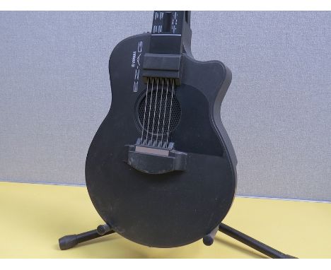 A Yamaha EZ-AG electronic tuition guitar with manual 