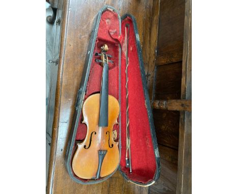 A late 19th Century full-size violin with two-piece back, pseudo Stradivarius label, cased with bow 