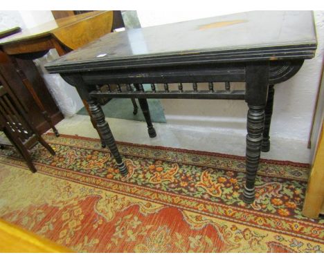 EDWARDIAN CARD TABLE, ebonised fold top card table with spindle gallery 