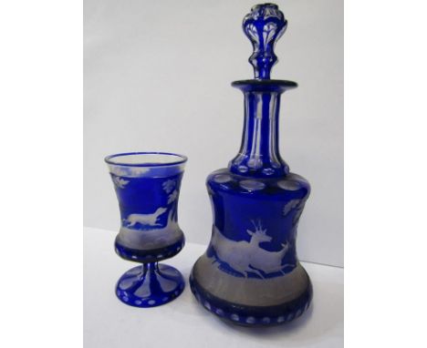 ANTIQUE CONTINENTAL GLASSWARE a Bohemian cased glass decanter and matching beaker decorated with a continuous scene of runnin