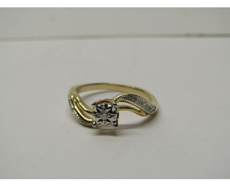 9CT YELLOW GOLD DIAMOND SOLITAIRE RING, principal brilliant cut diamond with further accent illusion set diamonds to each sho