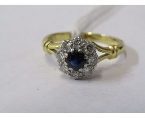 18CT YELLOW GOLD SAPPHIRE &amp; DIAMOND CLUSTER RING, principal dark blue sapphire surrounded by 8 well matched diamonds of g