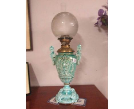 A Victorian oil lamp with turquoise base, (handles have been repaired).