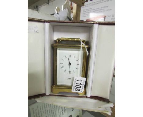 A Cope jeweller's brass carriage clock with case and documentation.