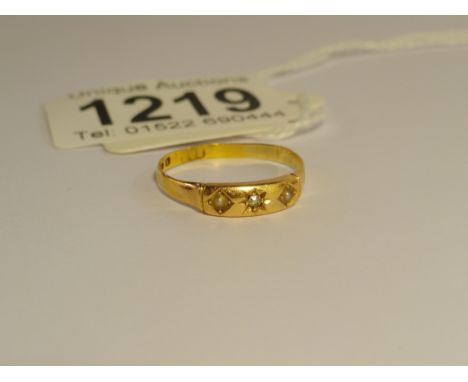 A Victorian diamond and pearl three stone 18ct gold ring.