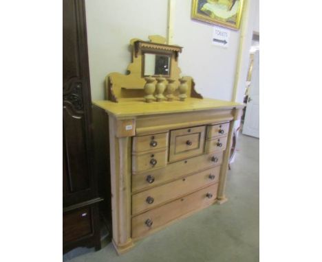A Victorian Scotch chest of drawers with mirror back (legs detached but present,).