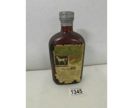 A bottle of White Horse Cellar Old Blend Scotch Whisky, Bottled 1948, No.284358. (damage to label).