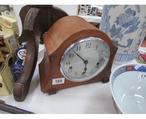 An old mantel clock with 3 winding holes.