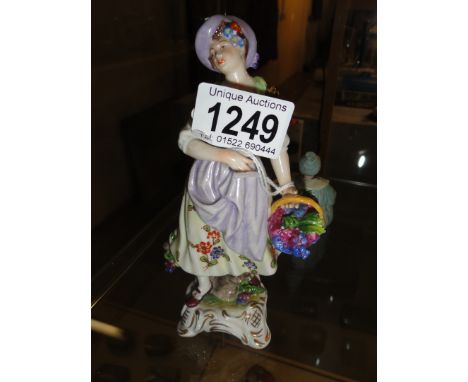 A 19th century continental porcelain figure marked with a crown over the letter K and 610.