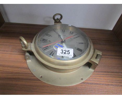 A brass ships' clock, middle eastern ship name: Radco.