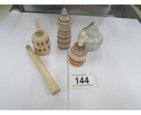 3 19th century ivory scent bottles, a 19th century needle case and one other item.