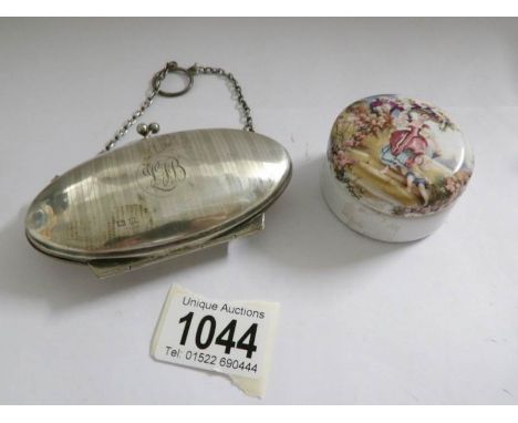 An engine turned silver purse dated 1915 and a painted lidded pot.