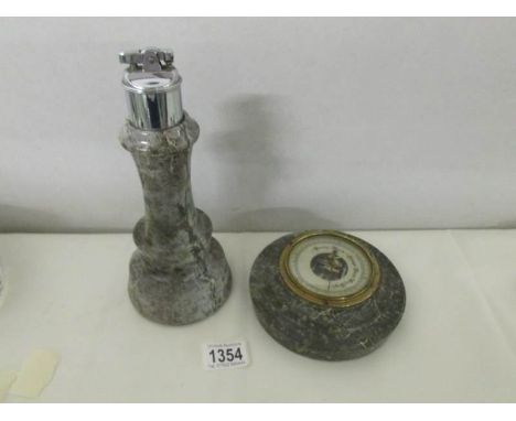 A Cornish serpentine lighthouse as a cigarette lighter and a barometer.