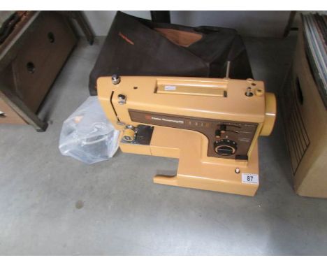 A Frister and Rossman sewing machine with cables, pedal, manual etc, working.