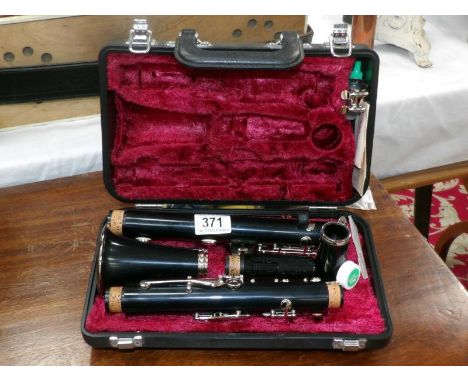 A cased Yamaha clarinet with accessories