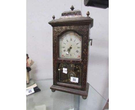 A mantle clock with battery movement, in working order.