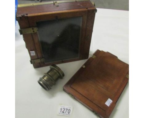 A plate camera with brass lens. (lens marked R. Piectilinear)